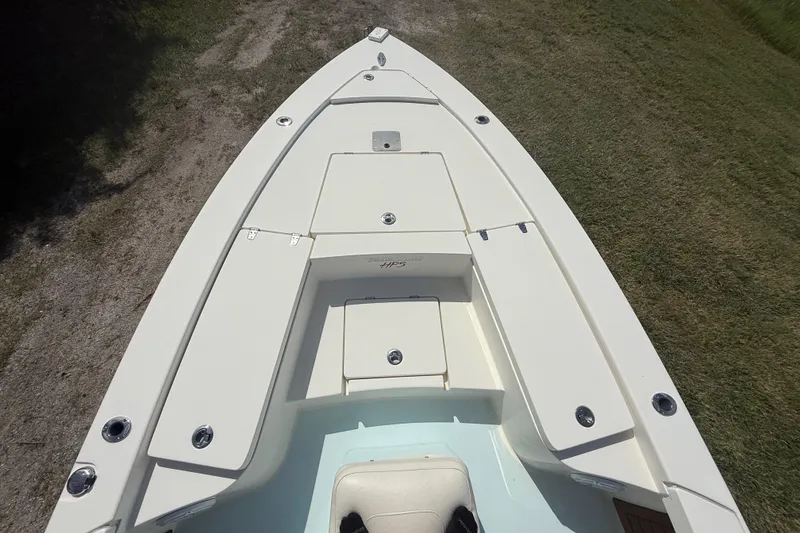 Slide: The Image of 2016 Pathfinder 2300 HPS boat deck with storage compartments, viewed from above. - 17