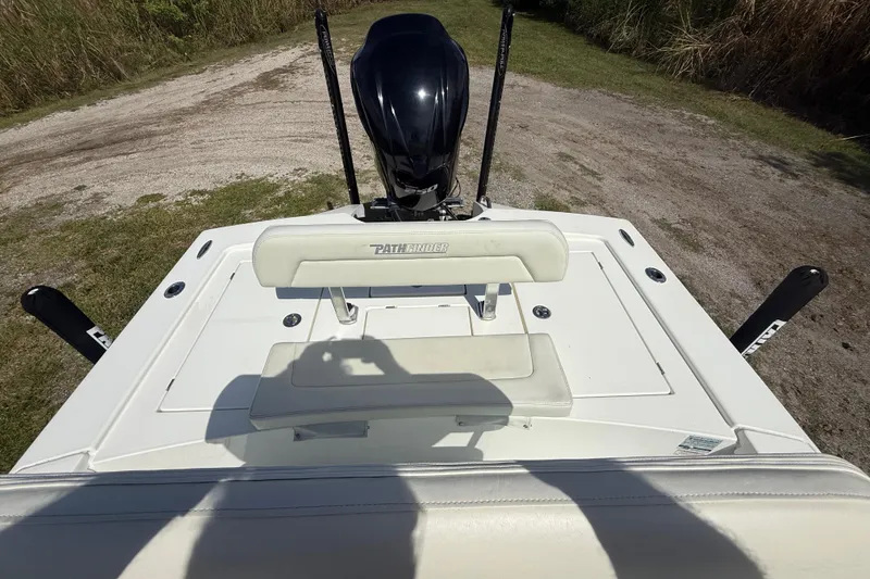 Slide: The Image of 2016 Pathfinder 2300 HPS boat with motor, viewed from the rear on a grassy area. - 23