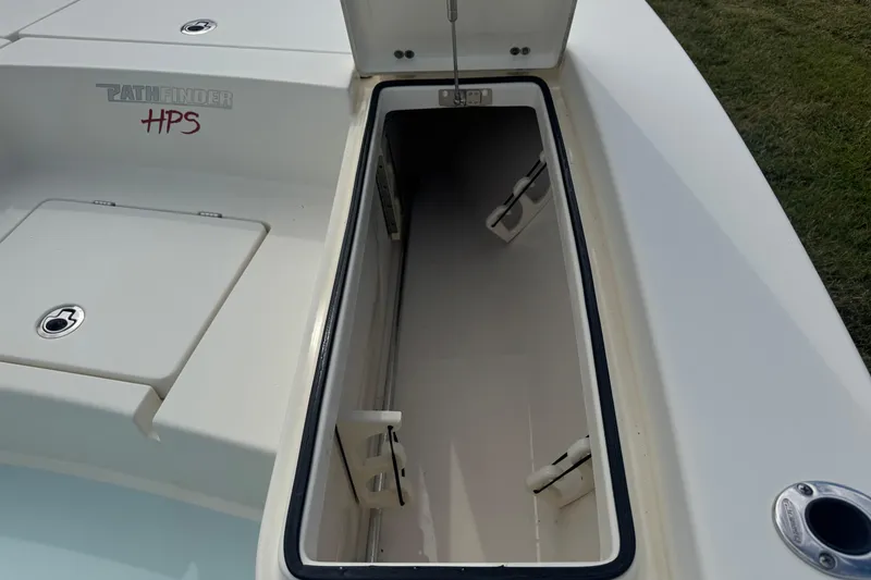 Slide: The Image of Open storage compartment on 2016 Pathfinder 2300 HPS boat deck. - 29