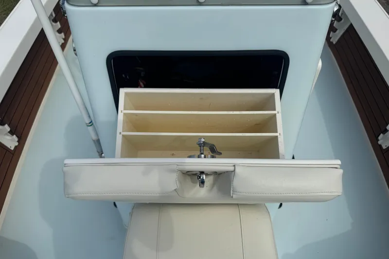 Slide: The Image of 2016 Pathfinder 2300 HPS boat interior with storage compartments and cushioned seating. - 35