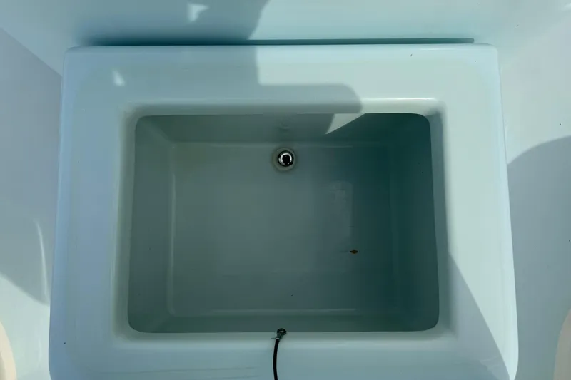 Slide: The Image of Livewell compartment in 2016 Pathfinder 2300 HPS boat, empty and clean. - 36