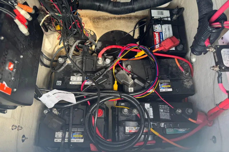 Slide: The Image of Battery compartment of a 2016 Pathfinder 2300 HPS with wiring and connections visible. - 38