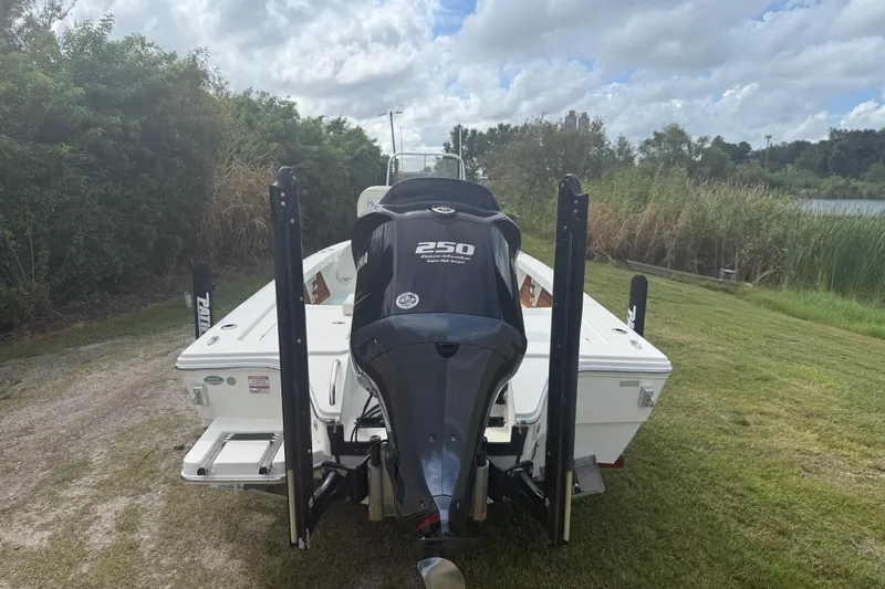 Slide: The Image of 2016 Pathfinder 2300 HPS boat with Yamaha 250 engine, parked on grassy area. - 4