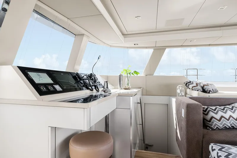 Slide: The Image of Luxurious interior of 2026 Sunreef 50 yacht with modern helm and seating area. - 11