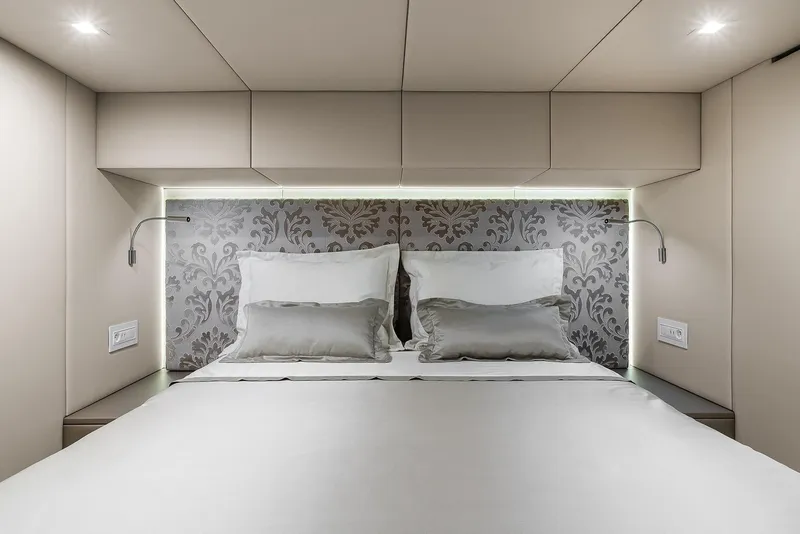 Slide: The Image of Luxurious bedroom interior of 2026 Sunreef 50 yacht with elegant bedding and ambient lighting. - 13