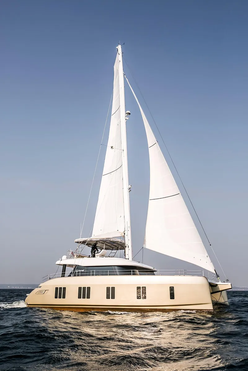 Slide: The Image of 2026 Sunreef 50 sailing catamaran on open sea with full sails. - 3