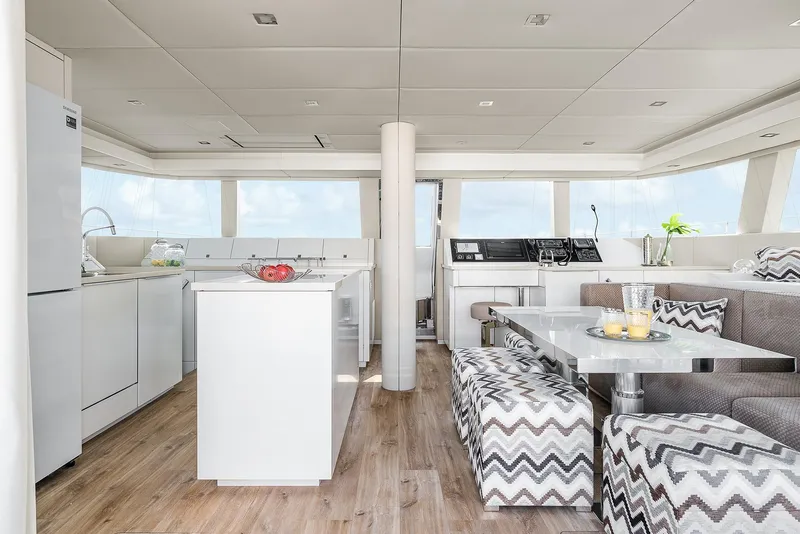 Slide: The Image of Luxurious interior of 2026 Sunreef 50 yacht with modern kitchen and dining area. - 7