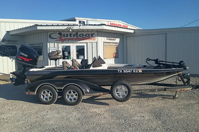 Slide: The Image of 2005 Ranger 519SVX Comanche boat with Yamaha engine at Outdoor Specialties store. - 1