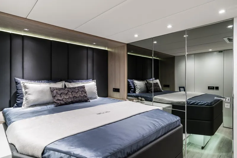 Slide: The Image of Luxurious bedroom interior of 2026 Sunreef 60 yacht with modern design and elegant bedding. - 10