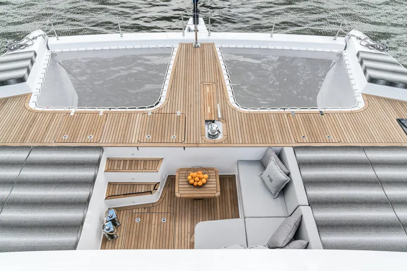 Slide: The Image of Luxurious 2026 Sunreef 60 yacht deck with stylish seating and wooden finish. - 11