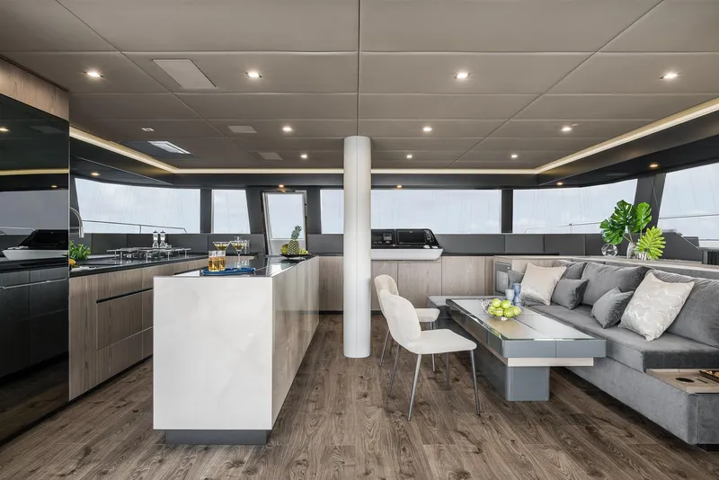 Slide: The Image of Luxurious interior of 2026 Sunreef 60 yacht with modern kitchen and elegant seating area. - 6