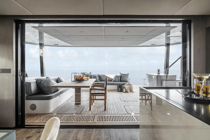Slide: The Image of Luxurious Sunreef 60 yacht interior with elegant seating and ocean view, 2026 model. - 7