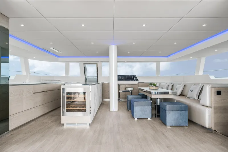 Slide: The Image of Luxurious interior of 2026 Sunreef 60 yacht with modern kitchen and seating area. - 8