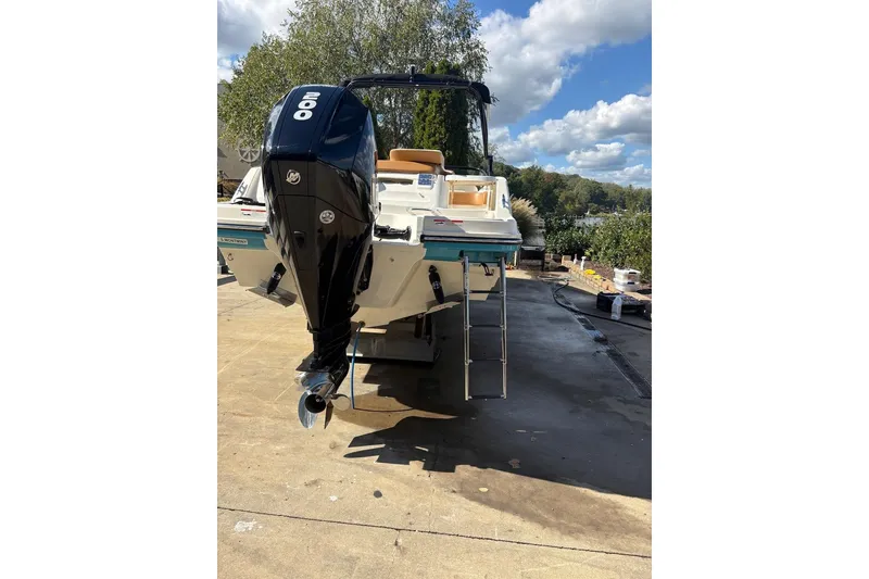 Slide: The Image of 2021 Bayliner VR6 Bowrider OB with 200 HP engine, parked outdoors. - 2