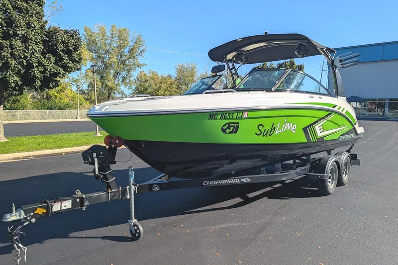 The Image of 2018 Chaparral Vortex 223 VRX boat in vibrant green on a trailer. - 0