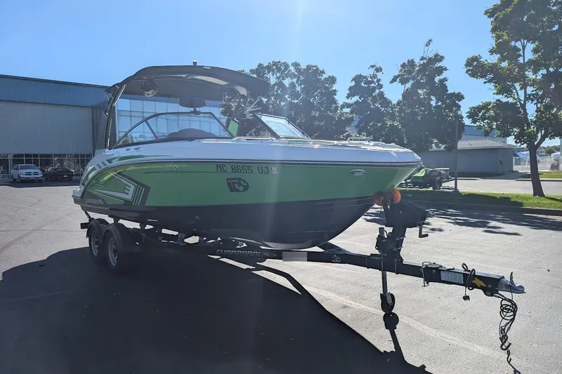 Slide: The Image of 2018 Chaparral Vortex 223 VRX boat on trailer, parked outdoors. - 2