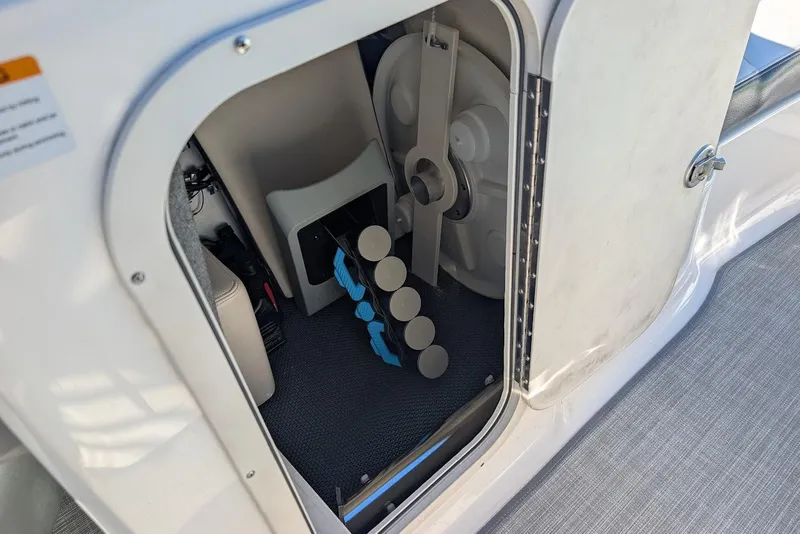 Slide: The Image of 2018 Chaparral Vortex 223 VRX storage compartment with equipment and accessories. - 20