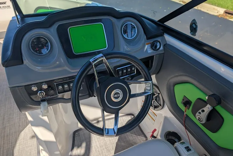 Slide: The Image of 2018 Chaparral Vortex 223 VRX dashboard with steering wheel and control panel. - 23