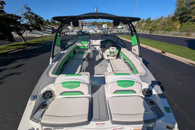 Slide: The Image of 2018 Chaparral Vortex 223 VRX boat with green accents, spacious seating, and sleek design. - 24