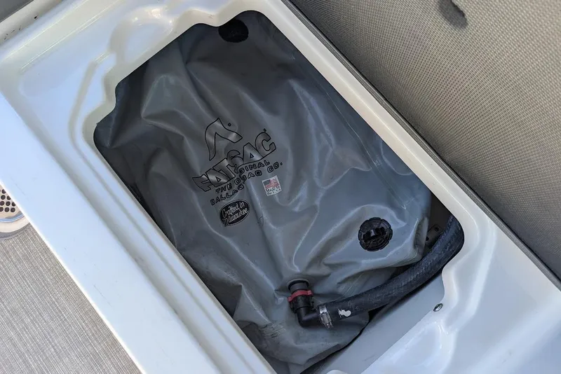 Slide: The Image of 2018 Chaparral Vortex 223 VRX ballast bag in storage compartment. - 27