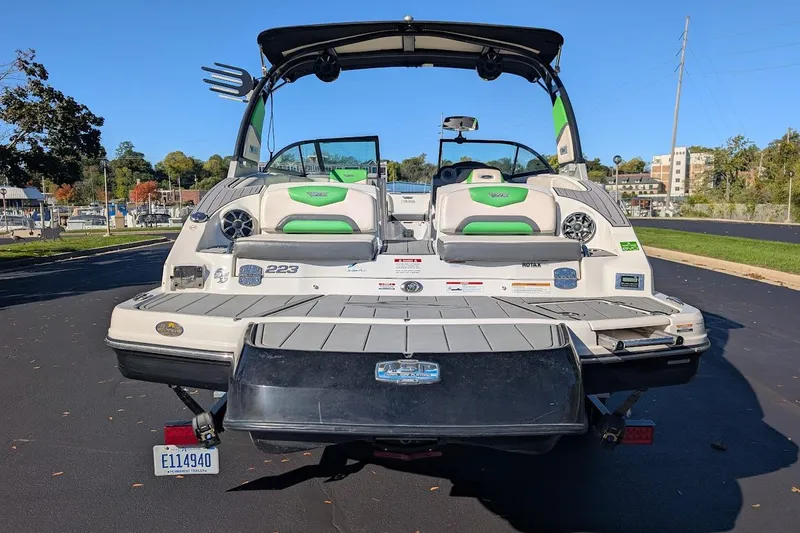 Slide: The Image of 2018 Chaparral Vortex 223 VRX boat, rear view, parked on pavement. - 5