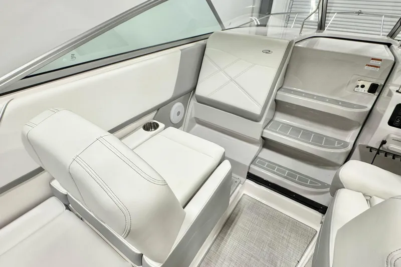 Slide: The Image of 2026 Regal 26 XO boat interior with white seating and modern design. - 10