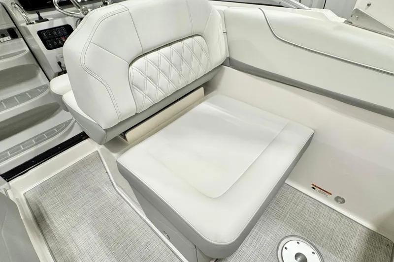 Slide: The Image of 2026 Regal 26 XO boat interior with white cushioned seating and modern design. - 7