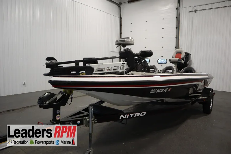 Slide: The Image of 2014 Nitro Z-7 boat in showroom, featuring Minn Kota Ultrex motor. - 1