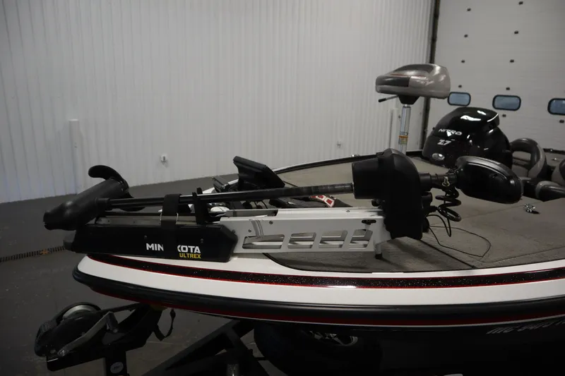 Slide: The Image of 2014 Nitro Z-7 boat with Minn Kota Ultrex trolling motor in a garage setting. - 11