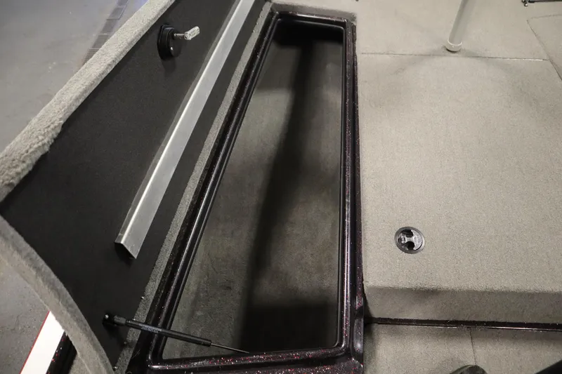 Slide: The Image of Open storage compartment in a 2014 Nitro Z-7 boat, featuring carpeted interior. - 20