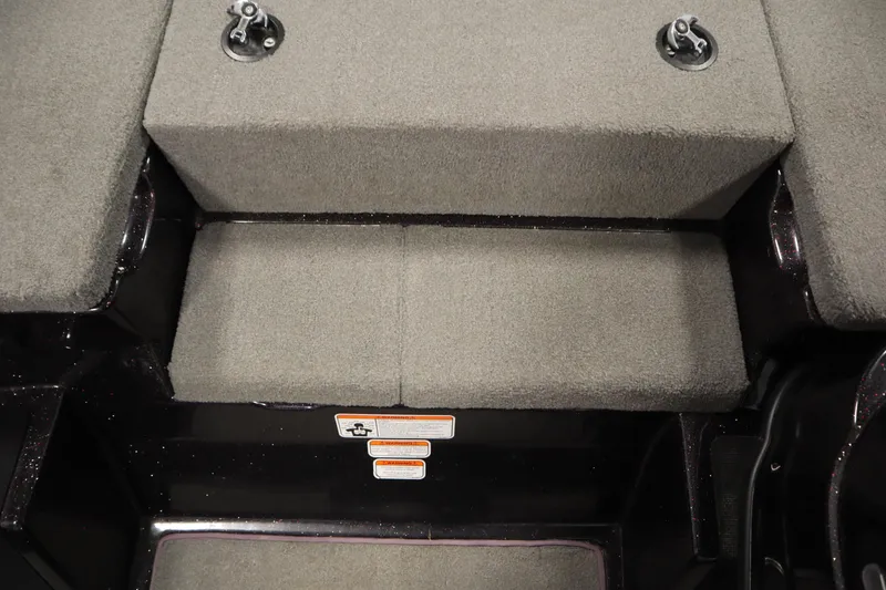 Slide: The Image of 2014 Nitro Z-7 boat interior with gray carpeted seating and storage compartments. - 22