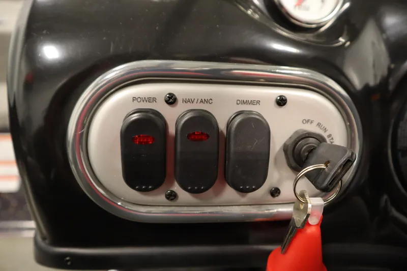 Slide: The Image of Control panel of a 2014 Nitro Z-7 boat with switches and ignition key. - 29