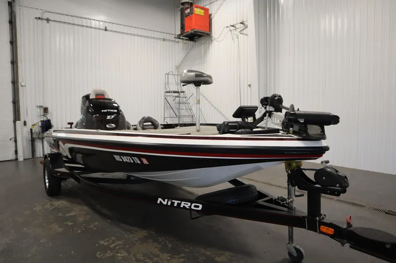 Slide: The Image of 2014 Nitro Z-7 boat in a garage, featuring sleek design and modern equipment. - 3