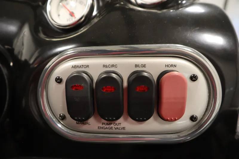 Slide: The Image of Control panel of a 2014 Nitro Z-7 boat with switches for aerator, recirculation, bilge, and horn. - 30