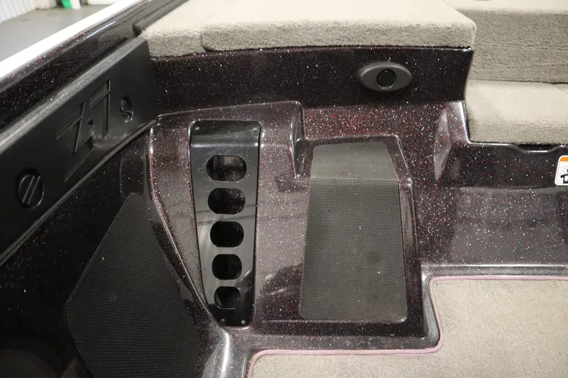 Slide: The Image of Interior of a 2014 Nitro Z-7 boat with textured flooring and storage compartments. - 33