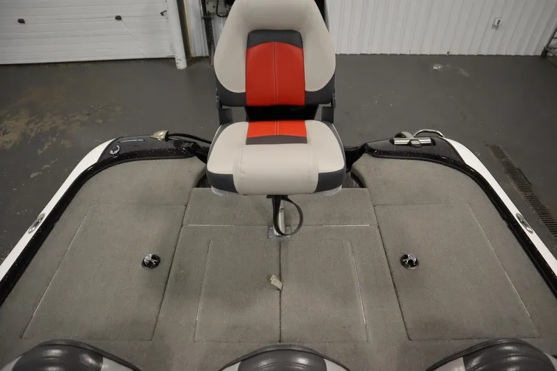 Slide: The Image of 2014 Nitro Z-7 boat interior with red and gray seating and carpeted deck. - 34