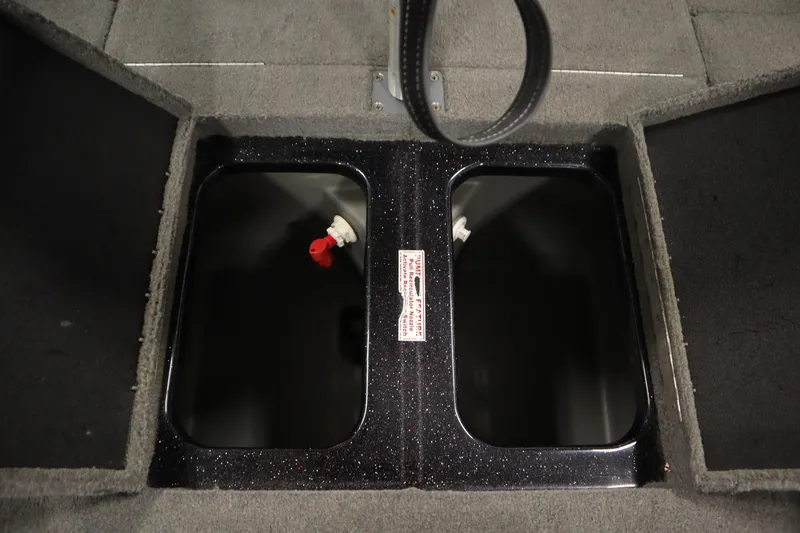 Slide: The Image of 2014 Nitro Z-7 boat storage compartments with open lids and visible interior. - 35