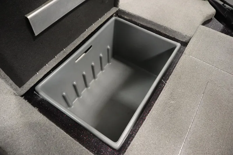 Slide: The Image of Storage compartment in 2014 Nitro Z-7 boat, featuring a spacious, carpeted interior. - 39