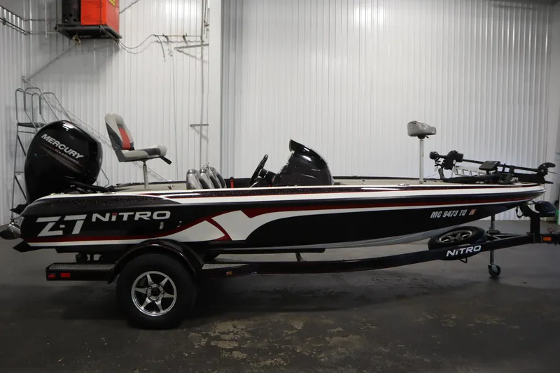 Slide: The Image of 2014 Nitro Z-7 boat with Mercury engine in a garage setting. - 4