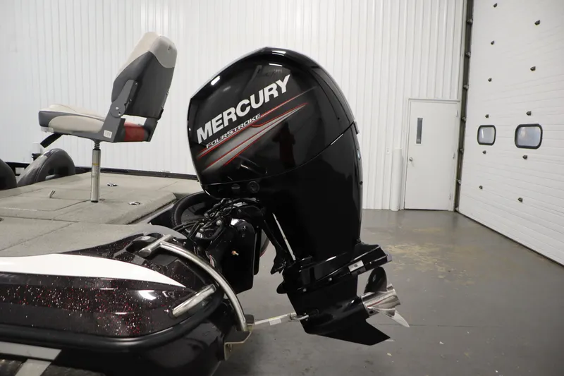 Slide: The Image of 2014 Nitro Z-7 boat with Mercury FourStroke engine in a garage setting. - 42