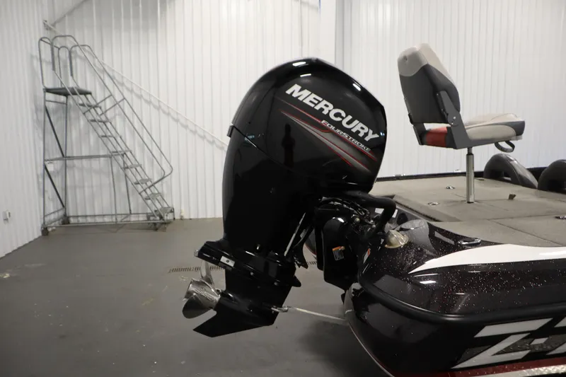 Slide: The Image of 2014 Nitro Z-7 boat with Mercury outboard motor in a garage setting. - 43