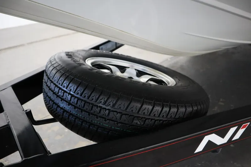 Slide: The Image of 2014 Nitro Z-7 trailer with spare tire, close-up view. - 47