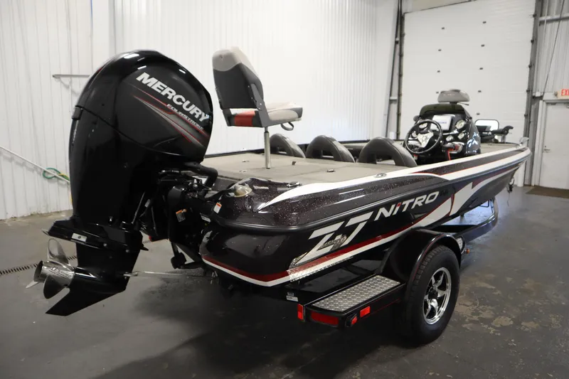 Slide: The Image of 2014 Nitro Z-7 boat with Mercury engine in a garage setting. - 5