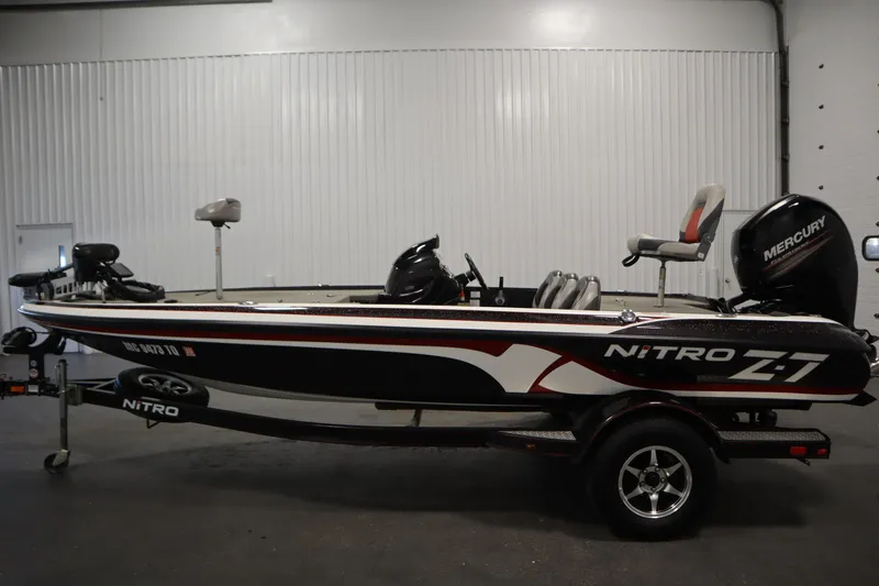 Slide: The Image of 2014 Nitro Z-7 fishing boat with Mercury engine in indoor setting. - 8