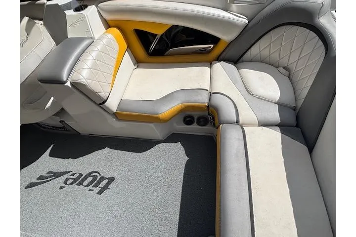 Slide: The Image of Interior of 2013 Tigé RZ4 boat with stylish seating and logo carpet. - 10