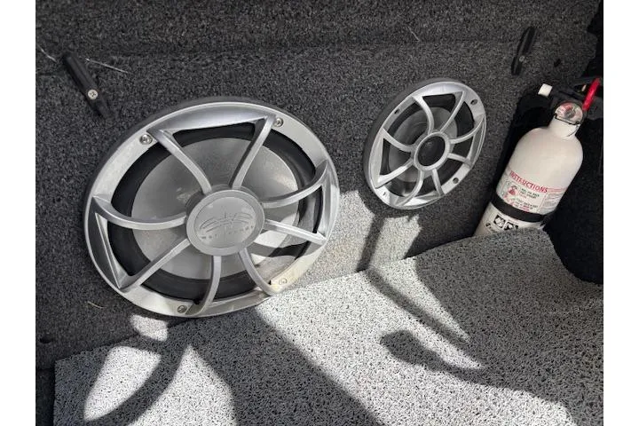 Slide: The Image of 2013 Tigé RZ4 boat interior with speakers and fire extinguisher. - 13