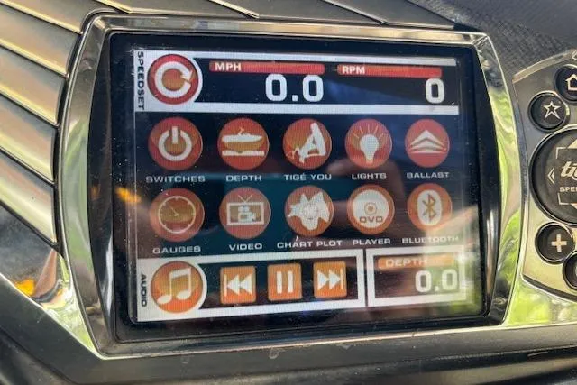 Slide: The Image of Touchscreen display in a 2013 Tigé RZ4 boat showing various control icons and settings. - 6