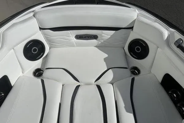 Slide: The Image of Luxurious interior of 2025 Supra SL 575 boat with white seating and speakers. - 11
