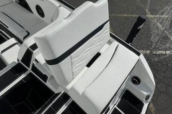 Slide: The Image of 2025 Supra SL 575 boat interior with white seating and sleek design. - 7