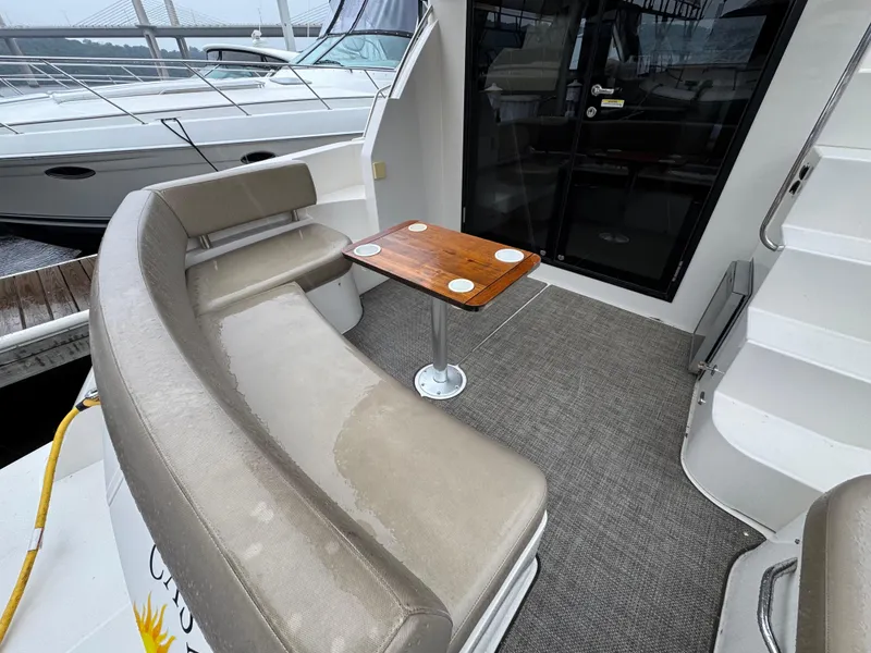 Slide: The Image of 2014 Carver C40 Command Bridge yacht interior with seating and table. - 10